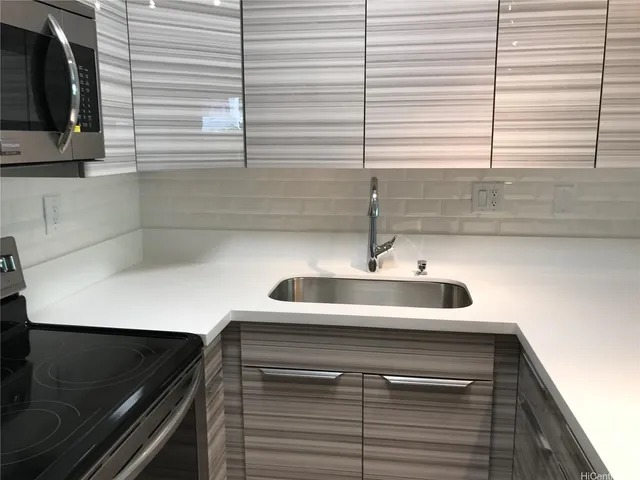 a kitchen with a sink and a window