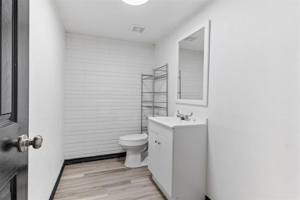 2802 Spring Valley Drive Bedford, TX 76021 - Photo 7 of 24 a bathroom with a sink toilet and mirror