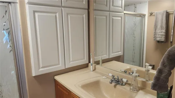 a bathroom with a sink and a mirror