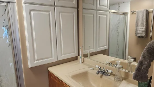 a bathroom with a sink and a mirror