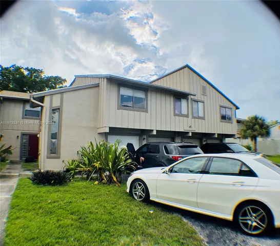 a car parked in front of a house