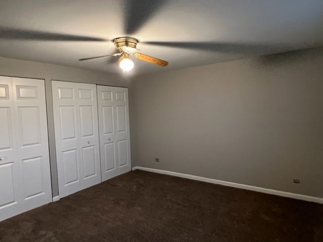 1010 Denham Place Schaumburg, IL 60169 - Photo 11 of 16 an empty room with windows and fan