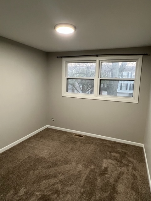 1010 Denham Place Schaumburg, IL 60169 - Photo 13 of 16 an empty room with a window