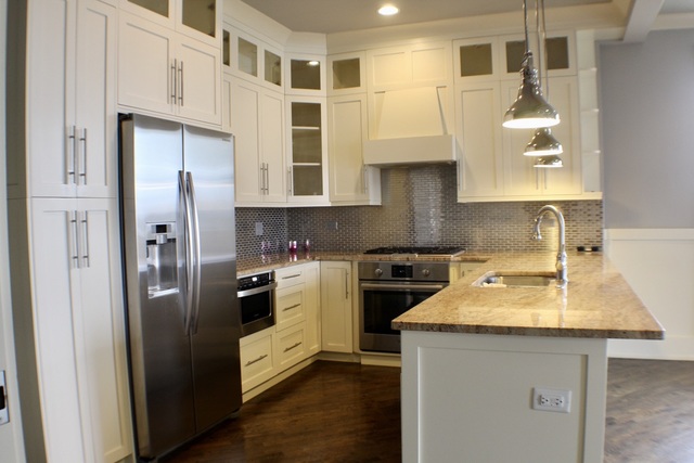 4029 South Ellis Avenue, Unit 5S Chicago, IL 60653 - Photo 4 of 31 a kitchen with stainless steel appliances granite countertop a refrigerator a stove and a sink