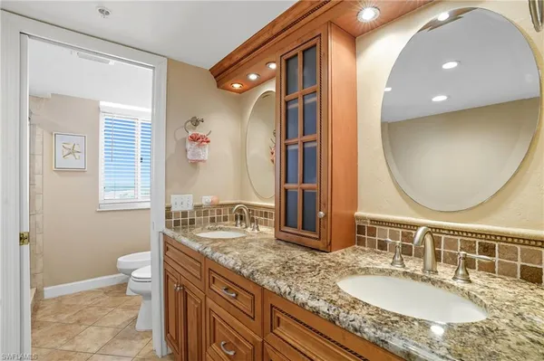 a bathroom with a bathtub and a toilet
