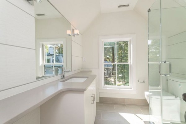 175 Coolidge Hill Road Cambridge, MA 02138 - Photo 23 of 25 a bathroom with a granite countertop sink and a large mirror