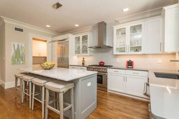 175 Coolidge Hill Road Cambridge, MA 02138 - Photo 7 of 25 a kitchen with stainless steel appliances granite countertop a stove a sink dishwasher and a refrigerator with wooden floor