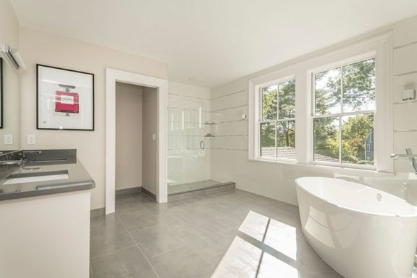 175 Coolidge Hill Road Cambridge, MA 02138 - Photo 10 of 25 a bathroom with a tub a sink and a window