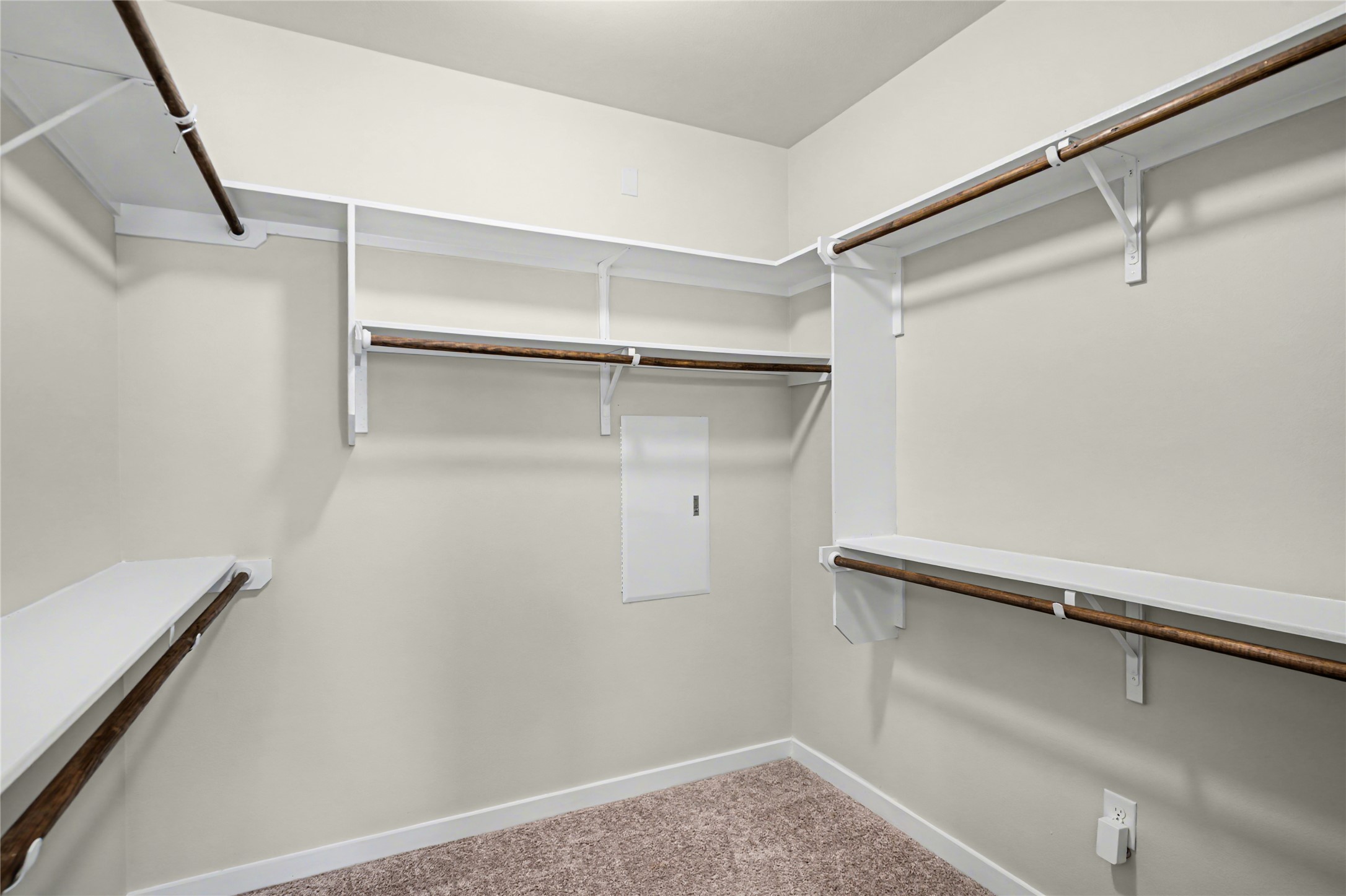 7216 Cherry Beam Path Austin, TX 78744 - Photo 16 of 32 a view of walk in closet with empty racks