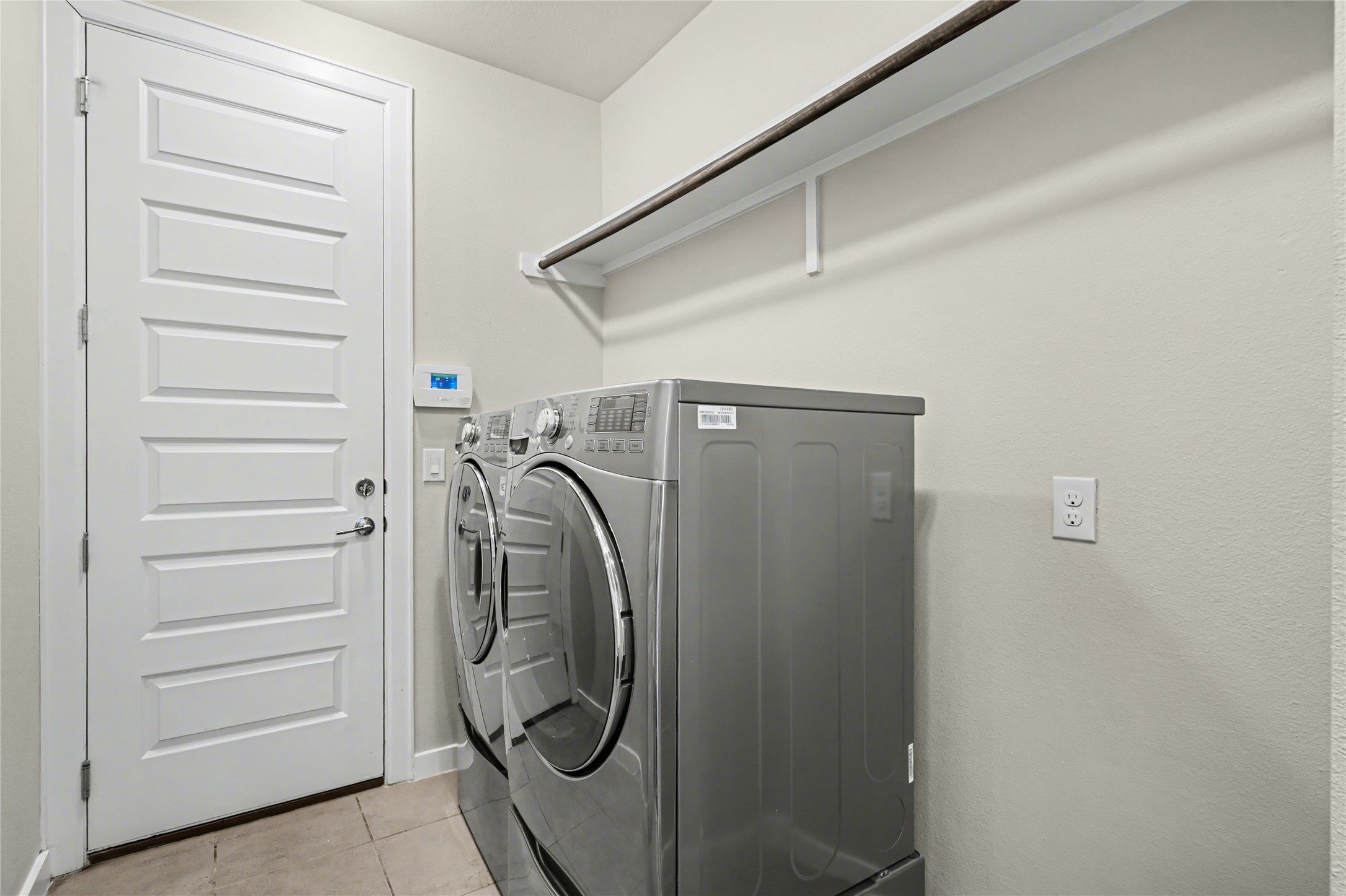 7216 Cherry Beam Path Austin, TX 78744 - Photo 18 of 32 a utility room with dryer and washer
