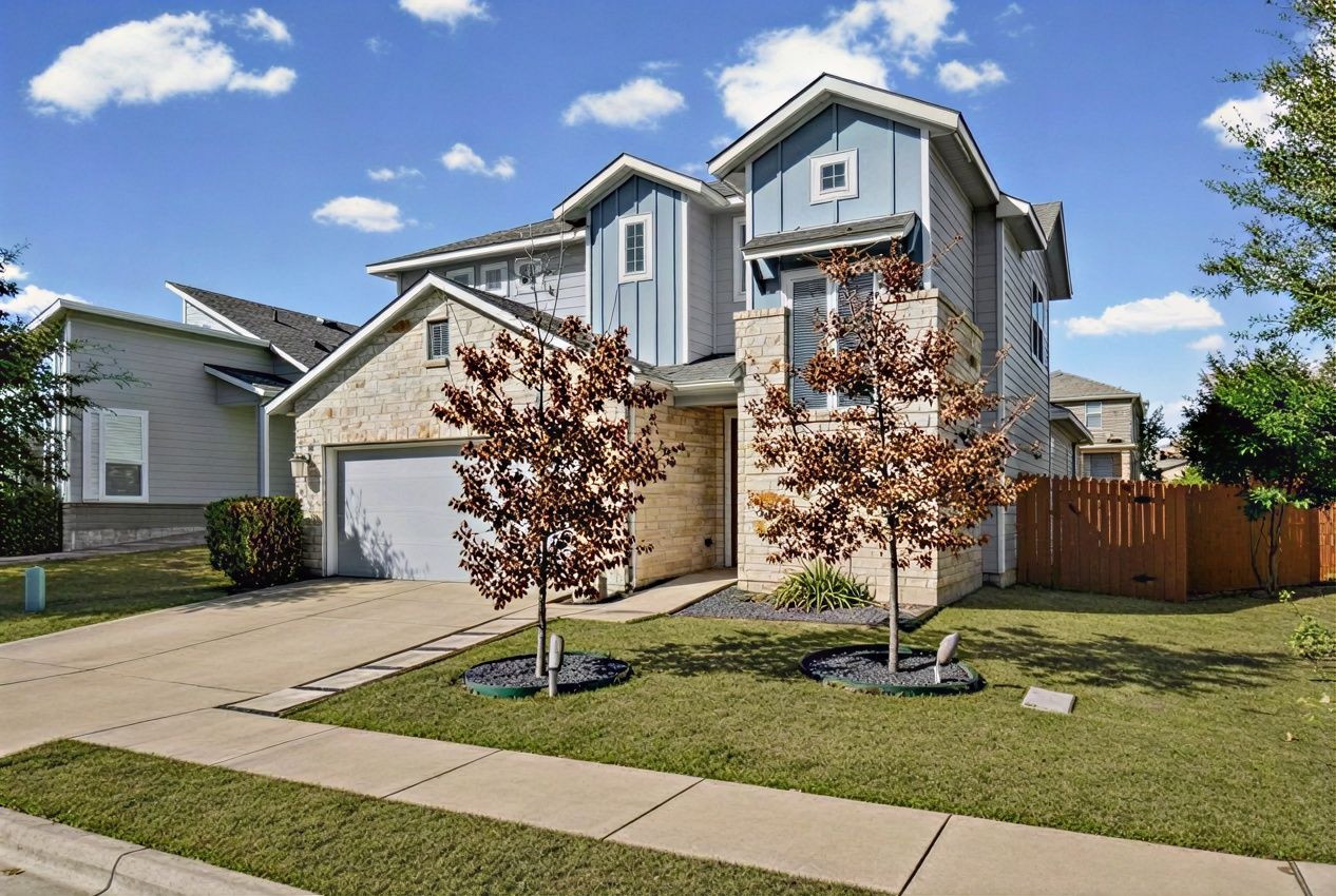 7216 Cherry Beam Path Austin, TX 78744 - Photo 2 of 32 a front view of a house with a yard