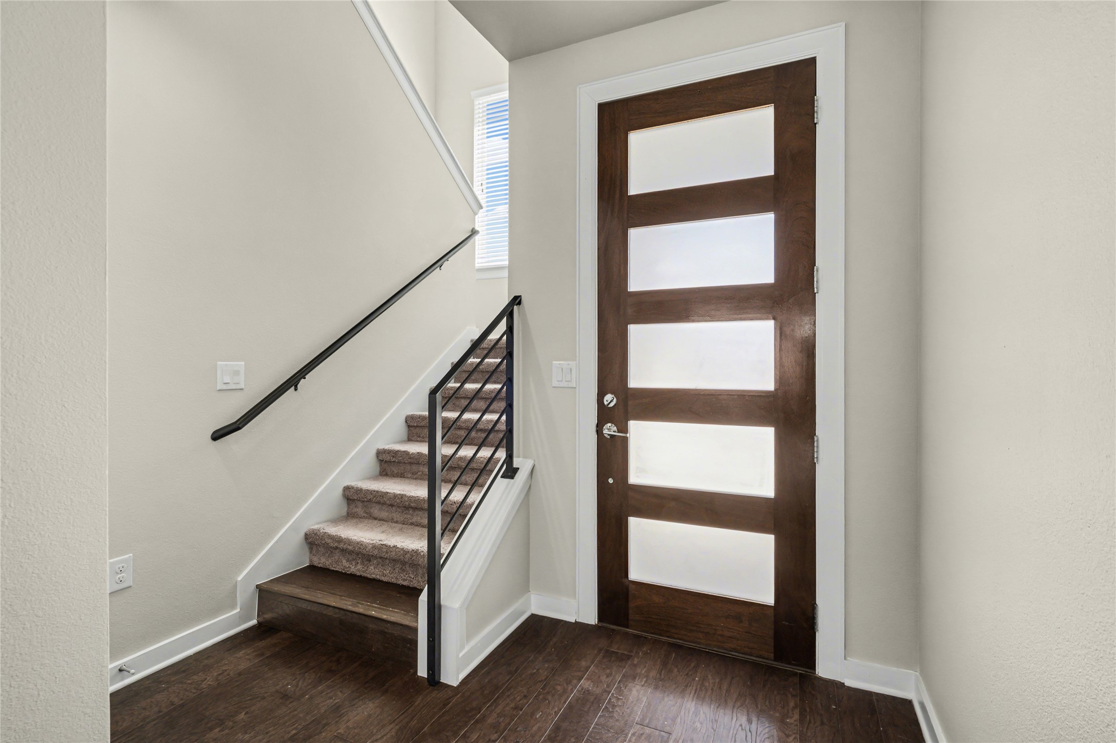 7216 Cherry Beam Path Austin, TX 78744 - Photo 4 of 32 a view of entryway with wooden floor