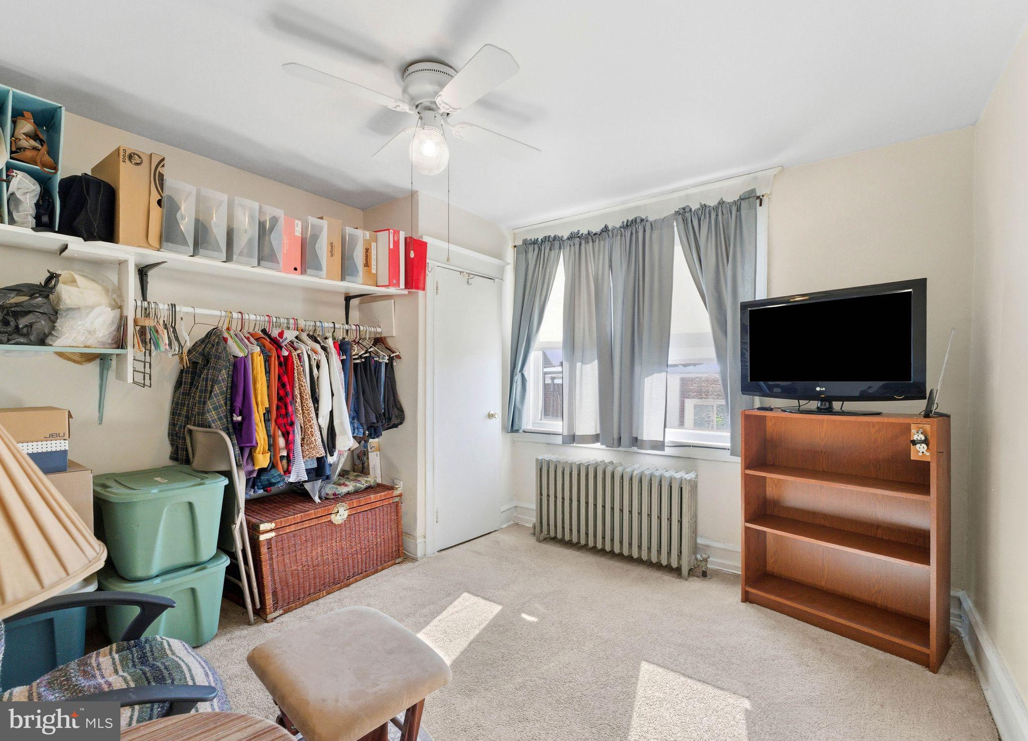 7828 Michener Avenue Philadelphia, PA 19150 - Photo 16 of 23 a view of a livingroom with furniture and a flat screen tv