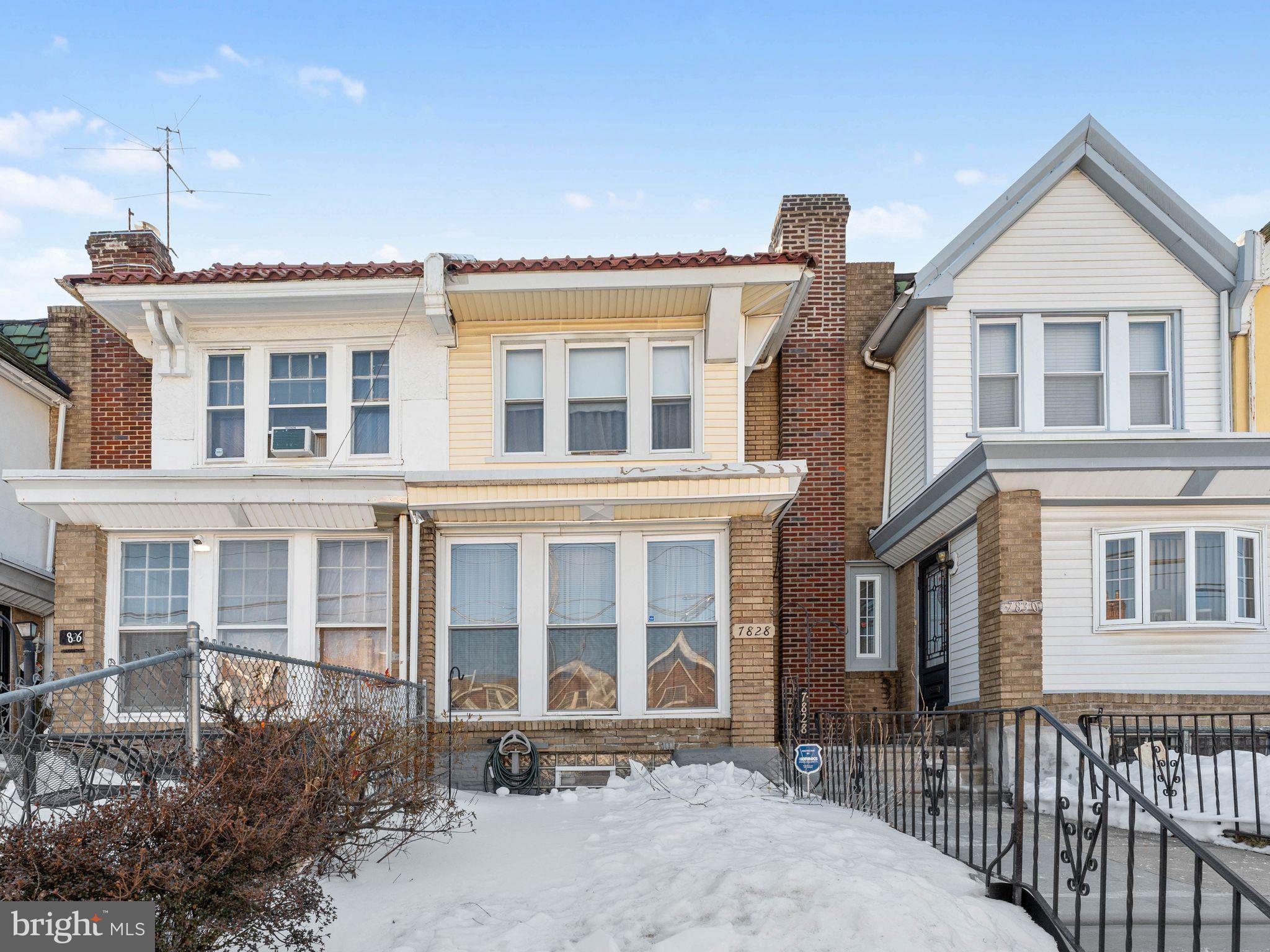 7828 Michener Avenue Philadelphia, PA 19150 - Photo 2 of 23 a front view of a house with a yard
