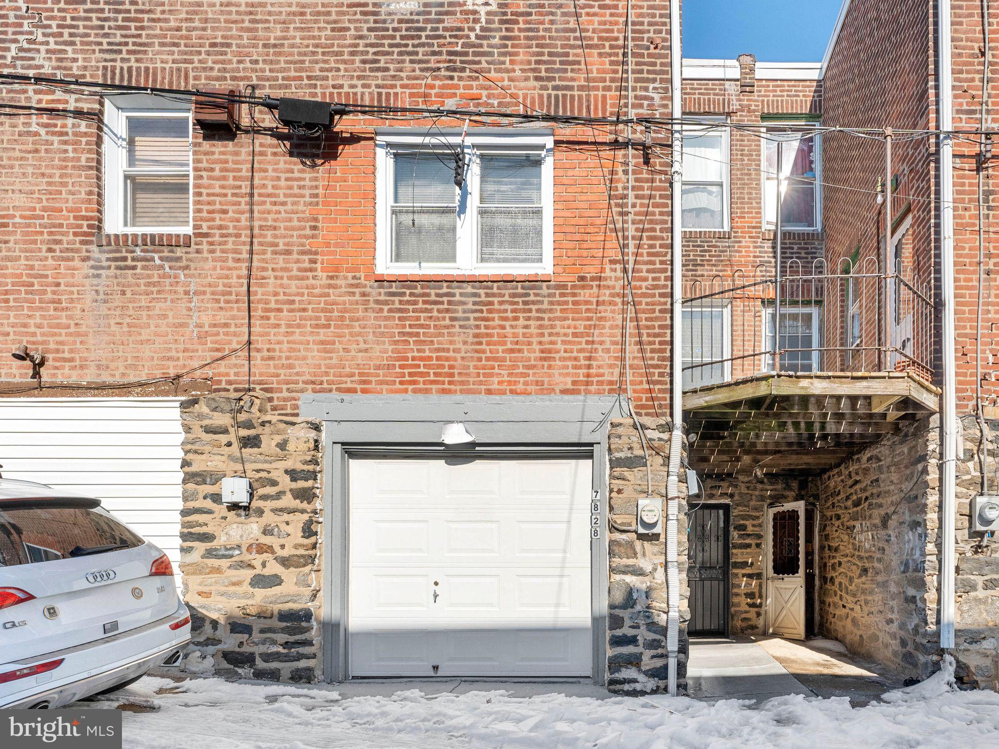 7828 Michener Avenue Philadelphia, PA 19150 - Photo 21 of 23 a brick building with a door and a window