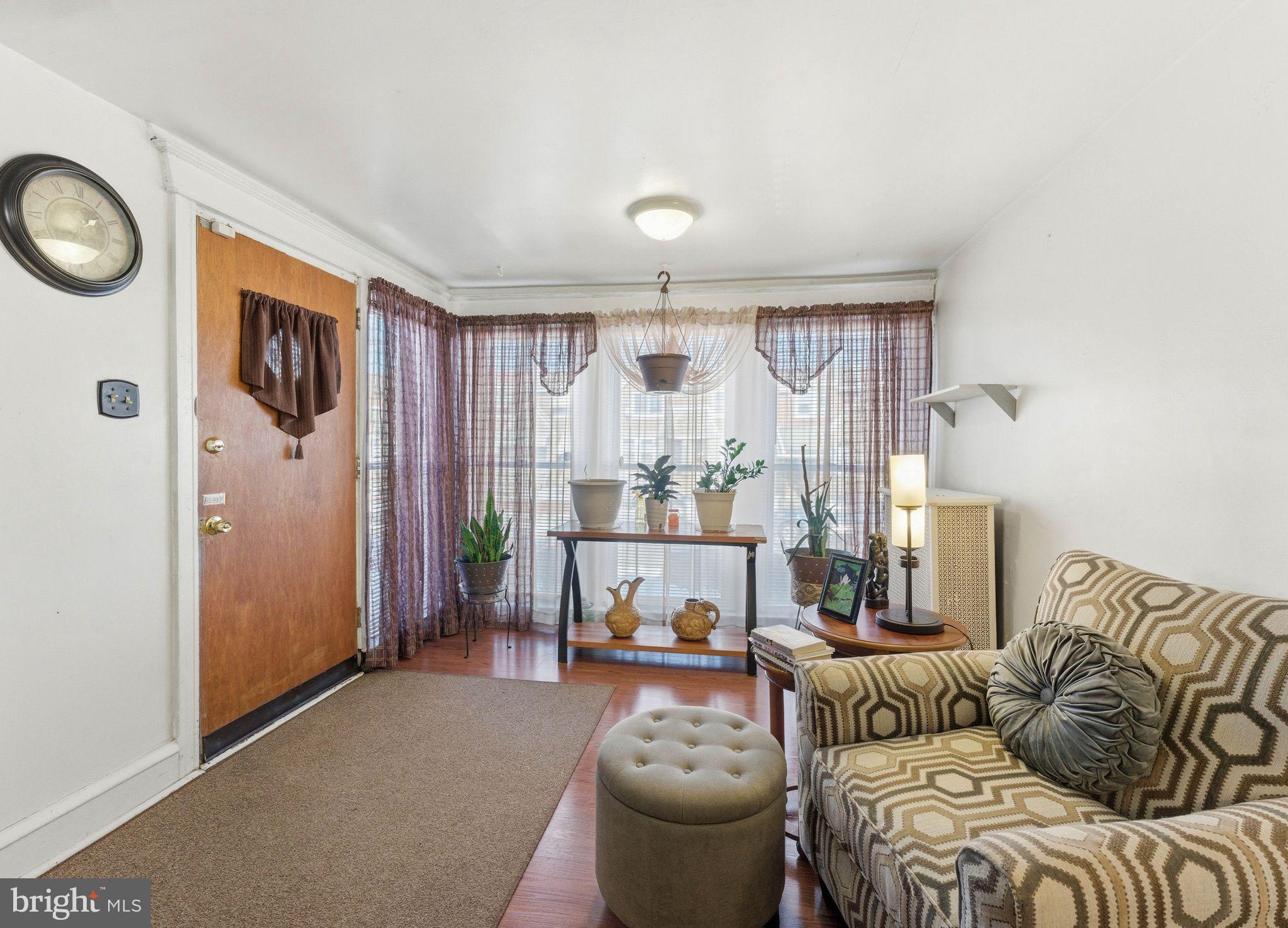 7828 Michener Avenue Philadelphia, PA 19150 - Photo 5 of 23 a living room with furniture and a large window