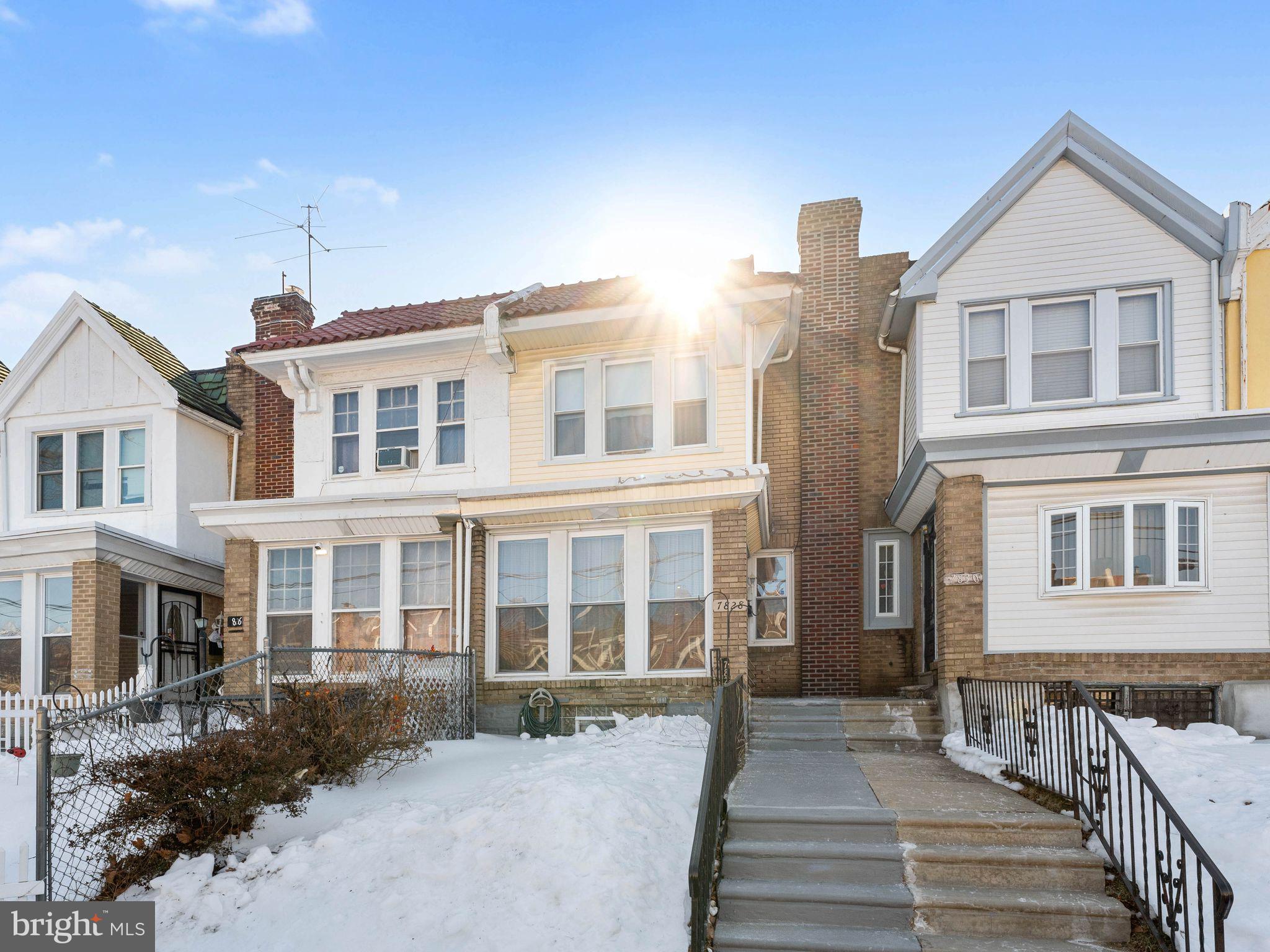 7828 Michener Avenue Philadelphia, PA 19150 - Photo 6 of 23 a front view of a house with a yard