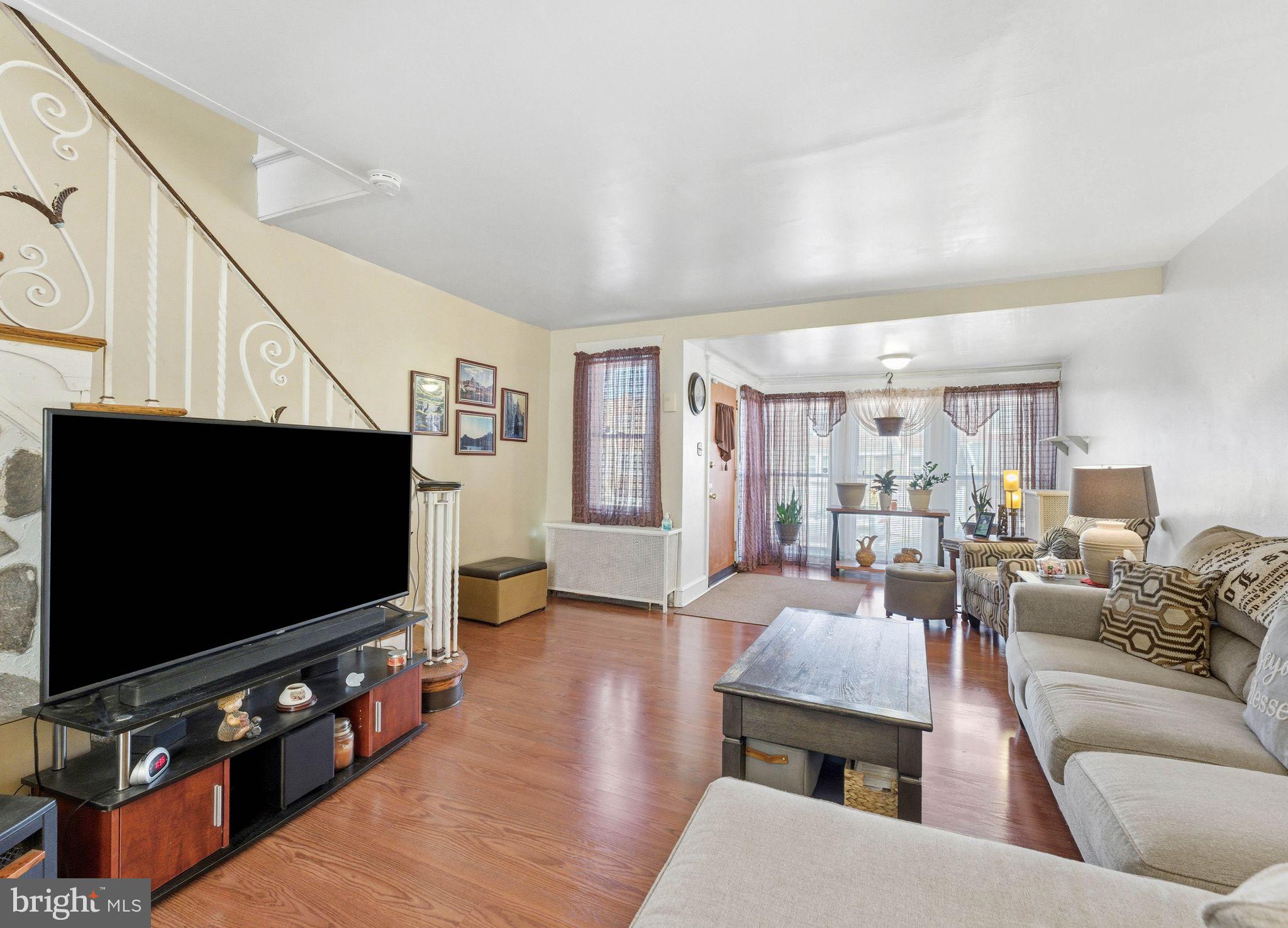 7828 Michener Avenue Philadelphia, PA 19150 - Photo 7 of 23 a living room with furniture and a flat screen tv