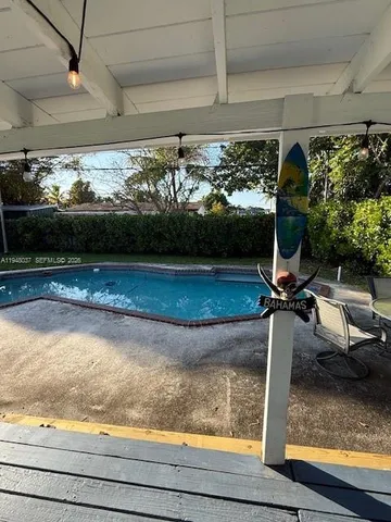 a view of swimming pool from a window
