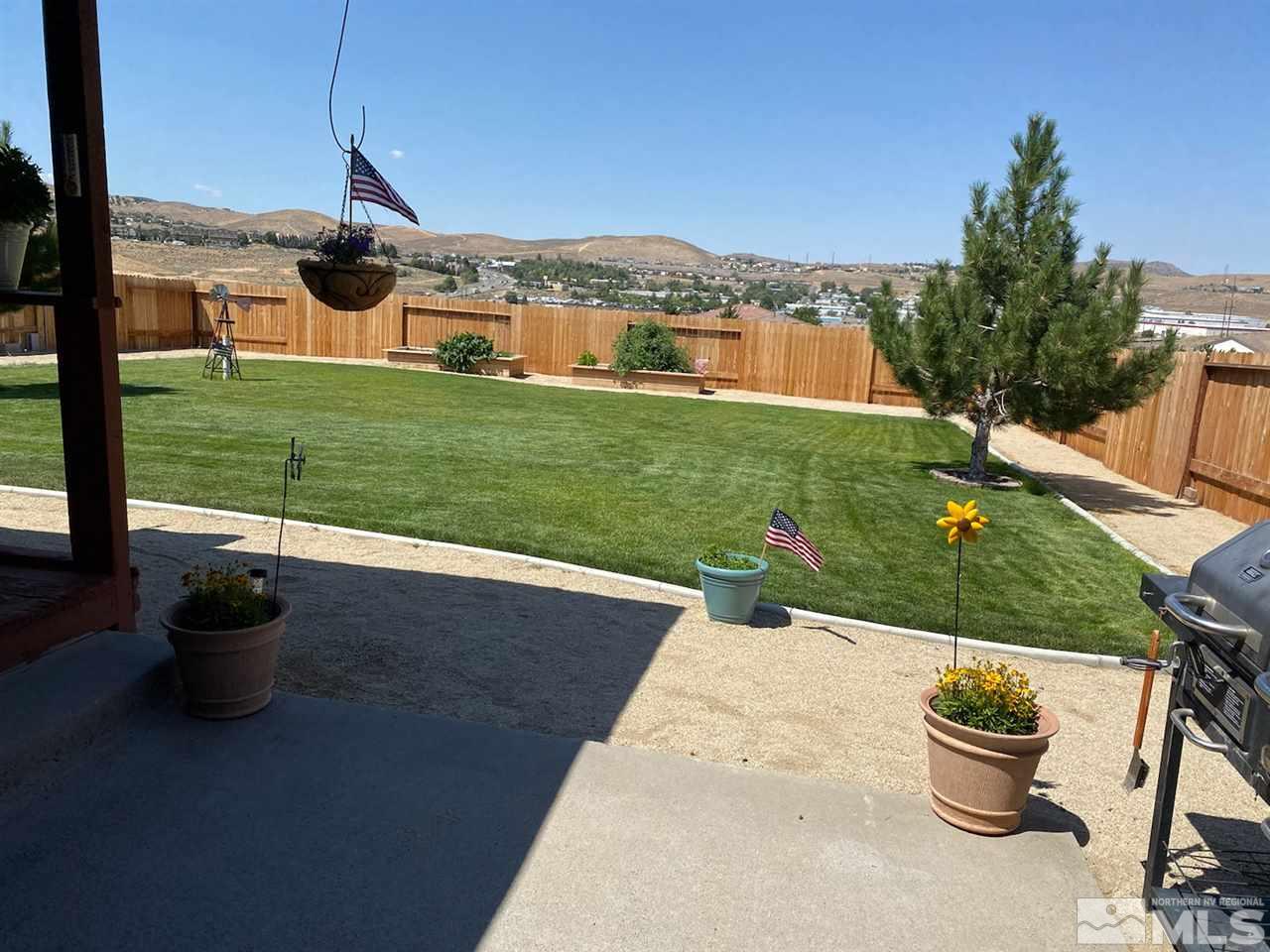 180 Silverstone Place Reno, NV 89512 - Photo 10 of 26 a view of a backyard with sitting area