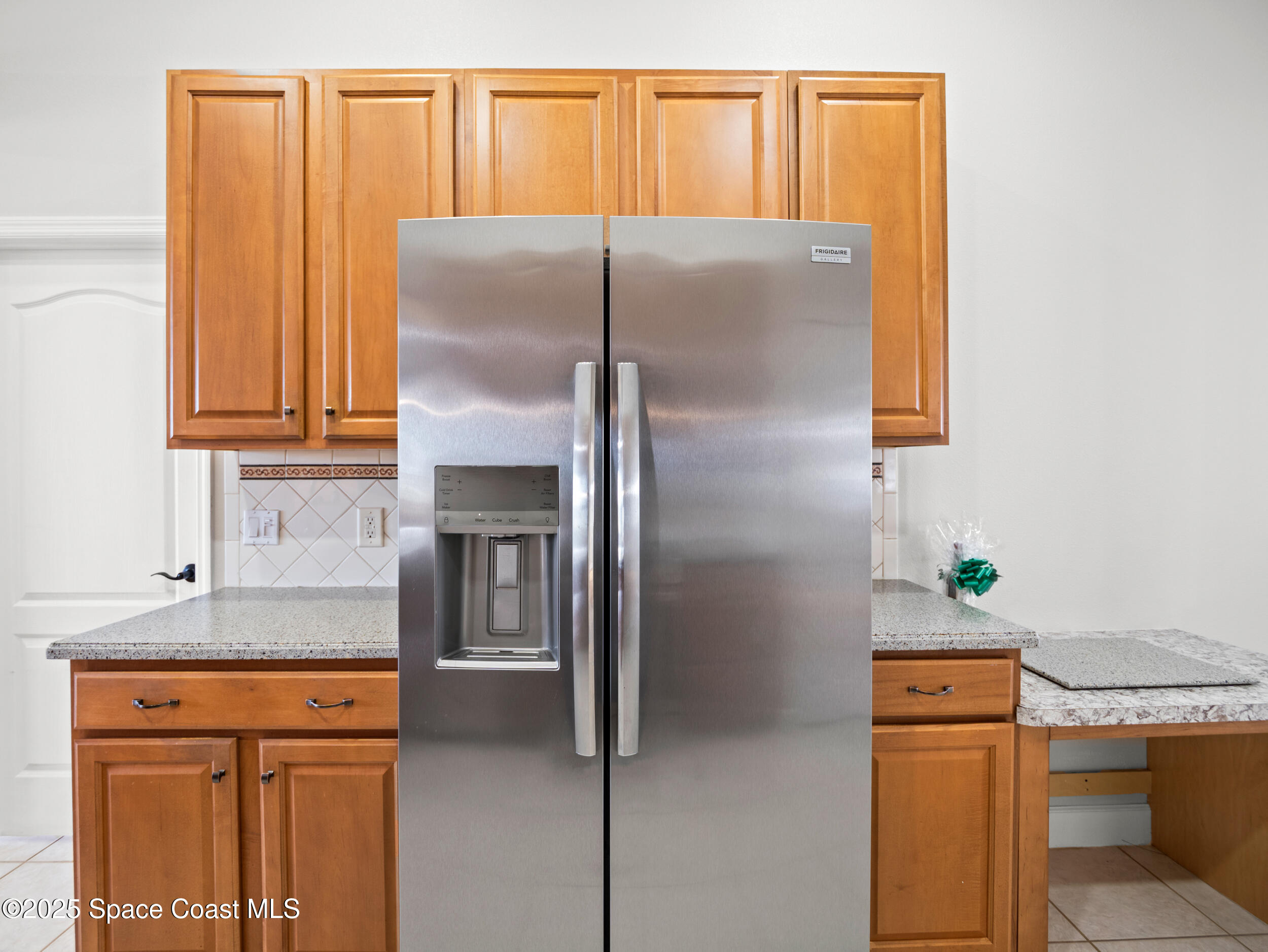 5015 Pinot Street Rockledge, FL 32955 - Photo 14 of 46 a kitchen with stainless steel appliances granite countertop a refrigerator and a stove
