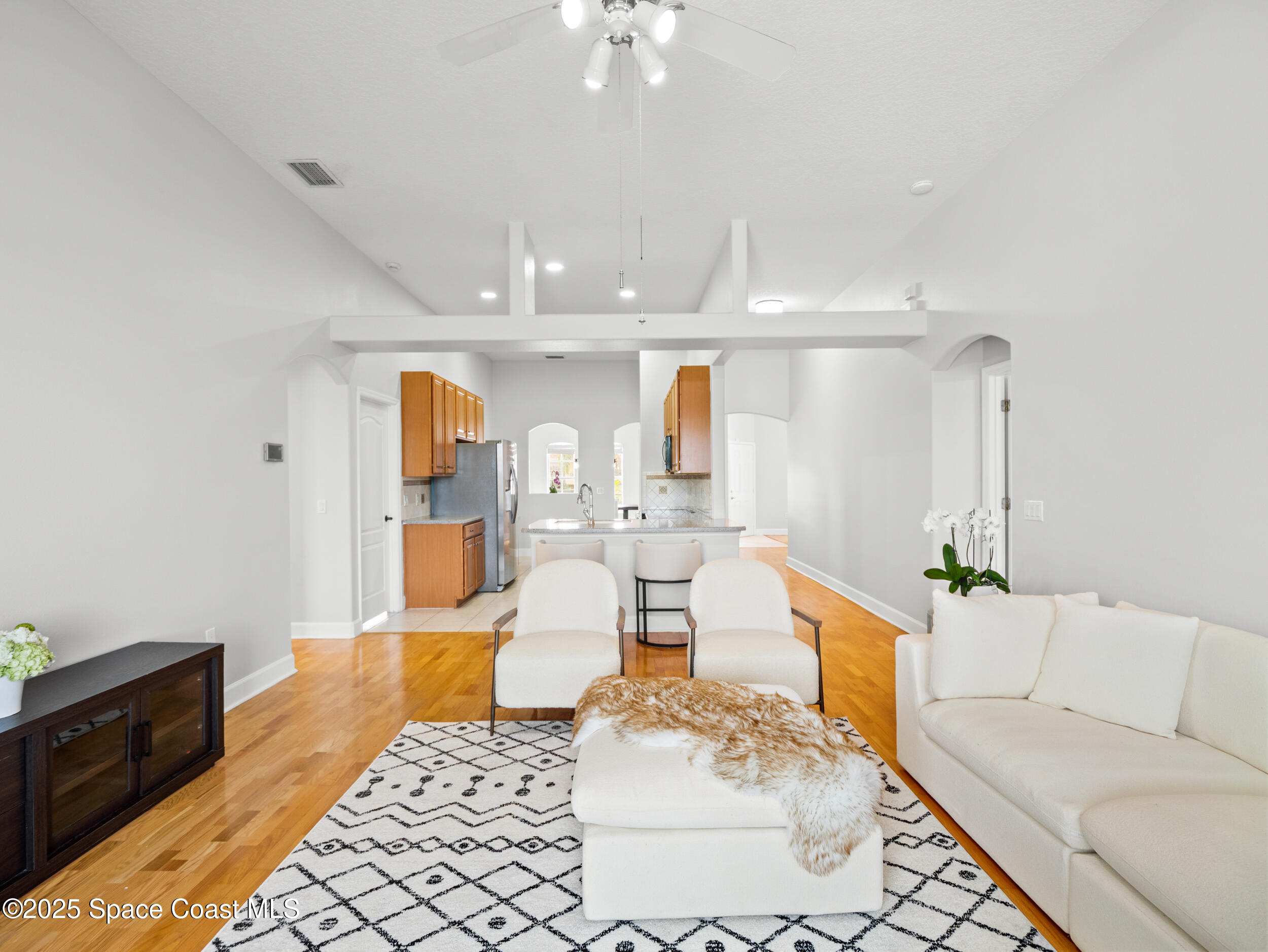 5015 Pinot Street Rockledge, FL 32955 - Photo 15 of 46 a living room with furniture and a chandelier