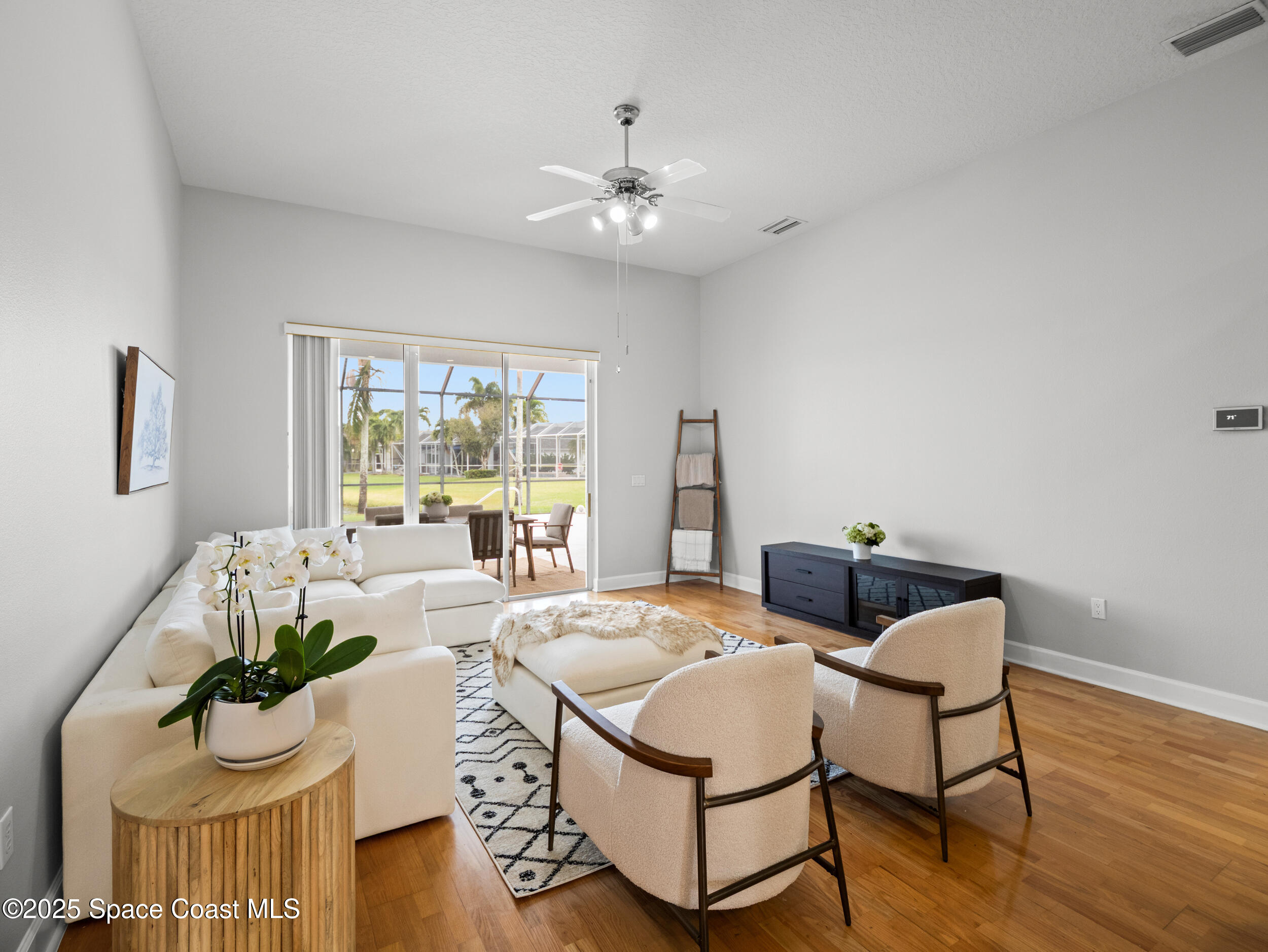 5015 Pinot Street Rockledge, FL 32955 - Photo 18 of 46 a living room with furniture and a large window