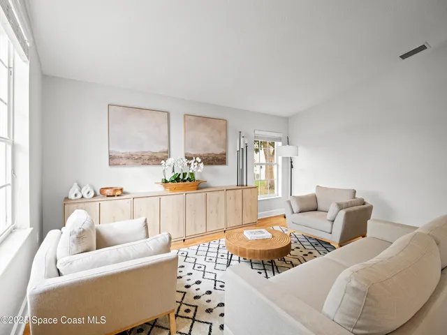 a spacious bathroom with a sink a large mirror and a shower