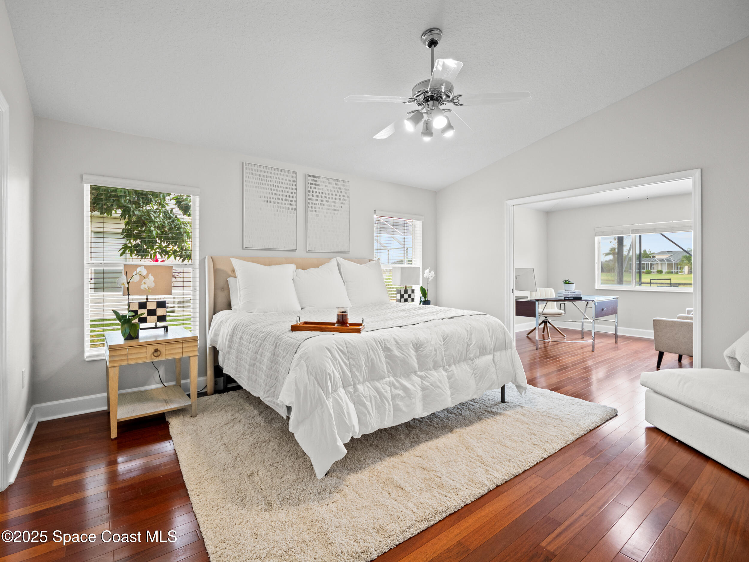 5015 Pinot Street Rockledge, FL 32955 - Photo 26 of 46 a bedroom with a large bed and a wooden floor