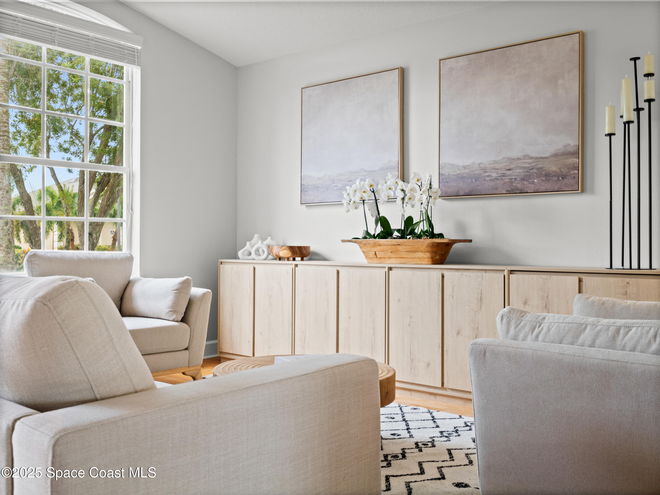 5015 Pinot Street Rockledge, FL 32955 - Photo 9 of 46 a living room with furniture and a large window