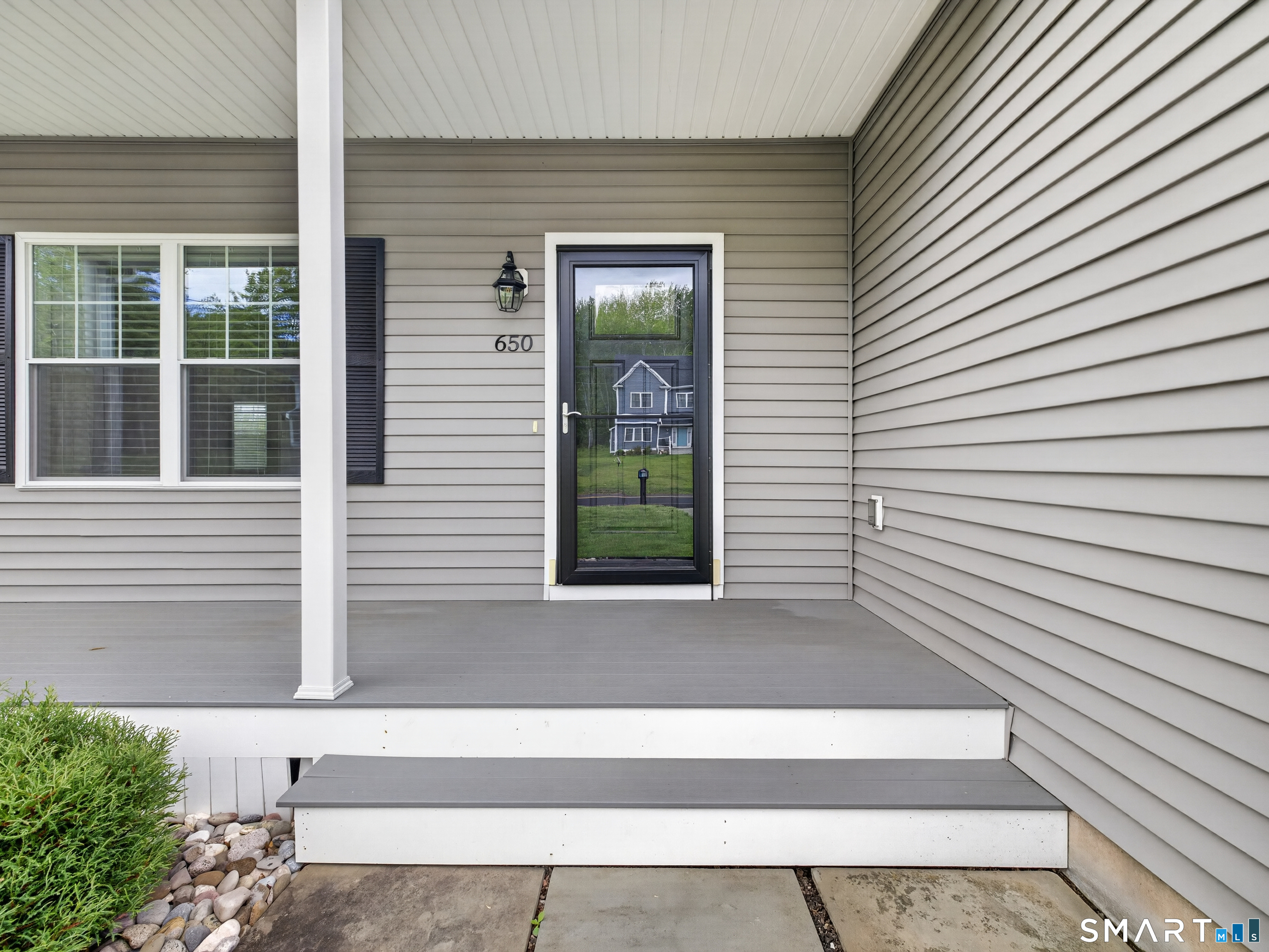650 Ridgewood Road Middletown, CT 06457 - Photo 5 of 40 a white house with a outdoor space