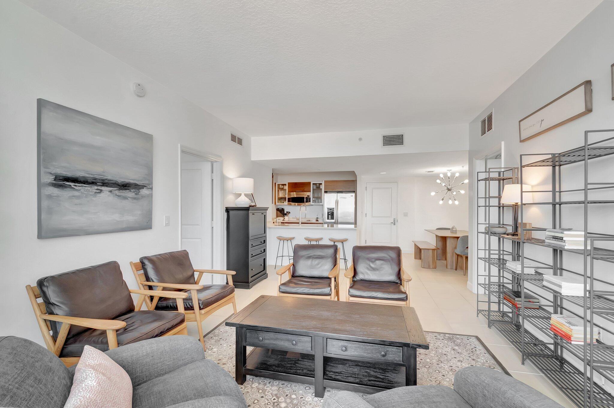 480 Hibiscus Street, Unit 709 West Palm Beach, FL 33401 - Photo 13 of 39 a living room with furniture and a table