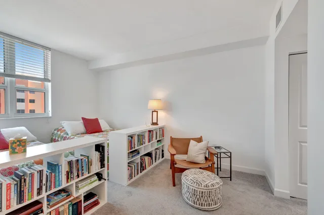 a room with furniture and a book shelf