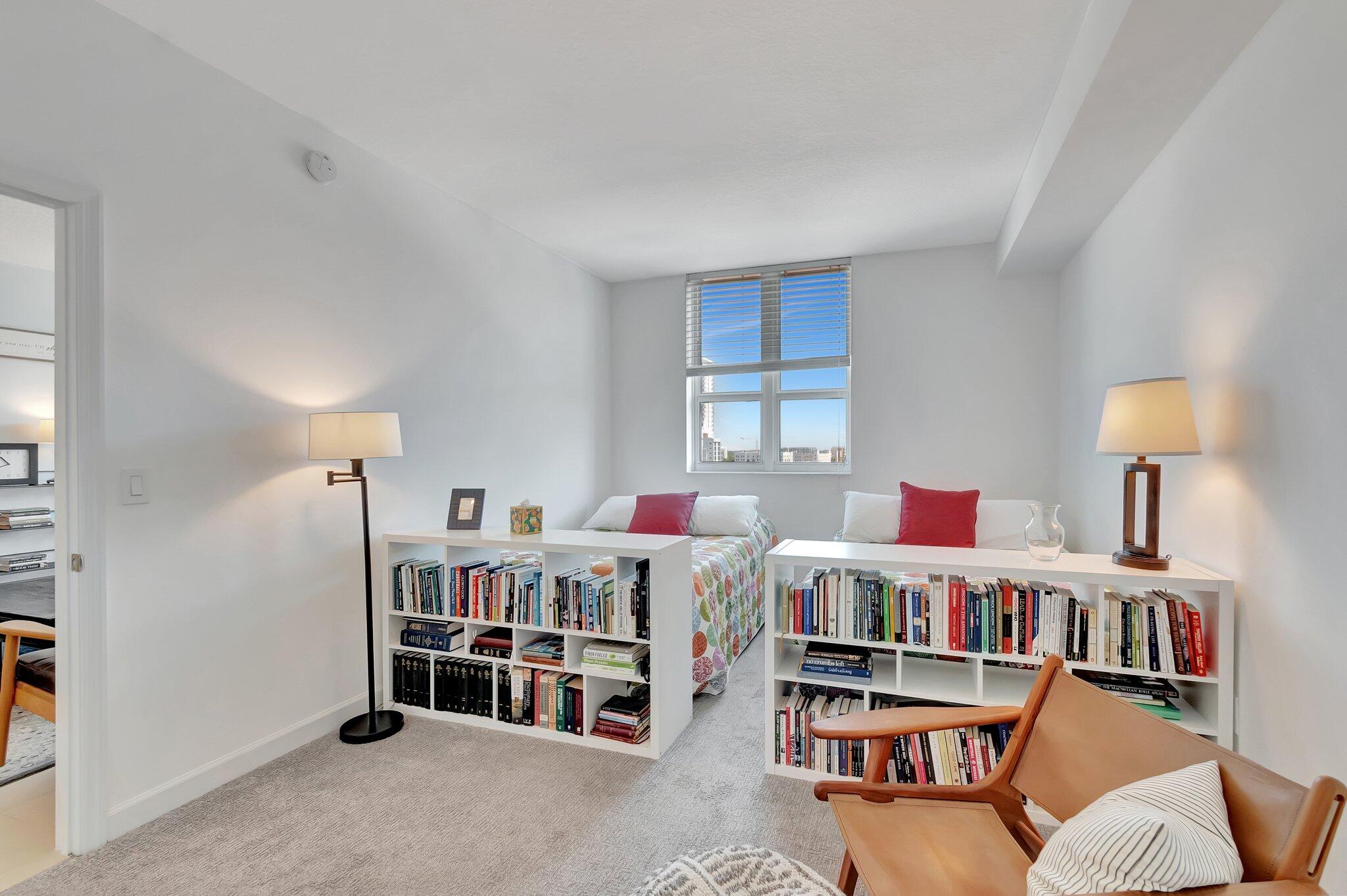 480 Hibiscus Street, Unit 709 West Palm Beach, FL 33401 - Photo 23 of 39 a room with furniture and a book shelf