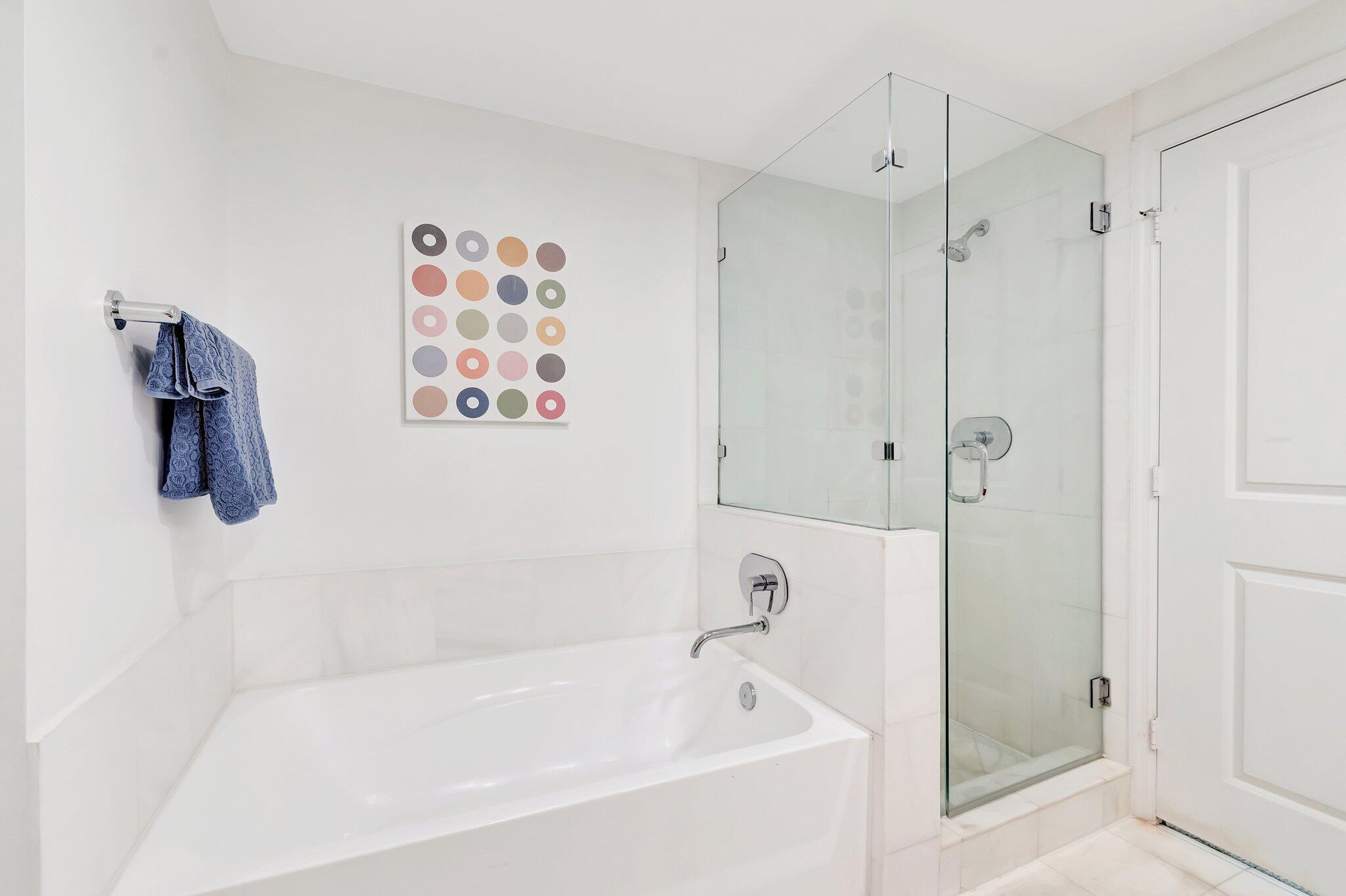 480 Hibiscus Street, Unit 709 West Palm Beach, FL 33401 - Photo 26 of 39 a white bath tub sitting next to a shower