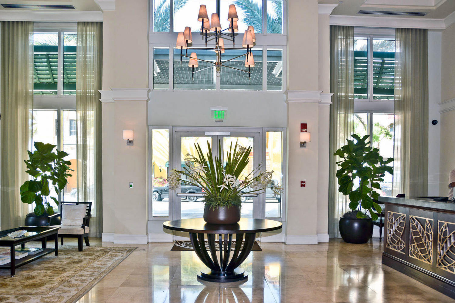 480 Hibiscus Street, Unit 709 West Palm Beach, FL 33401 - Photo 36 of 39 a vase of flowers sitting on a table in front of a window
