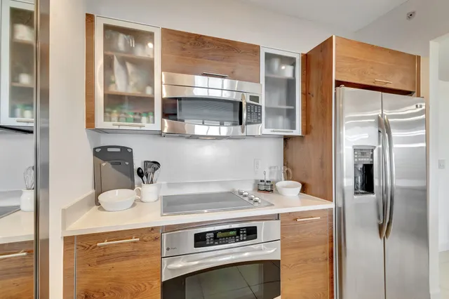 a kitchen with a refrigerator and a sink