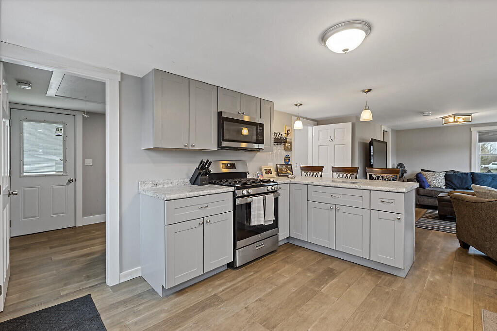 622 Waterville Road Unity, ME 04988 - Photo 10 of 19 Kitchen toward bedroom 2 & Laundry