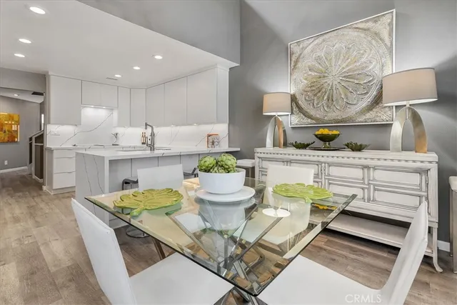 a dining room with a table and chairs