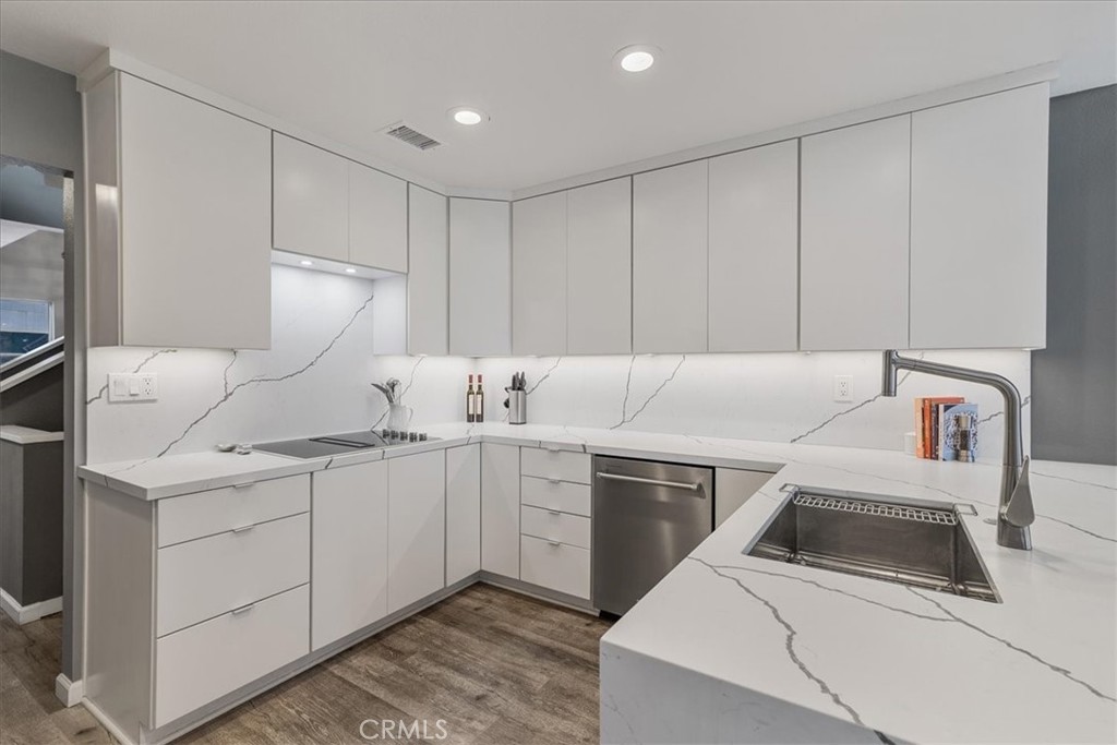 4 Logo Vista Dana Point, CA 92629 - Photo 17 of 44 a kitchen with a sink cabinets and appliances