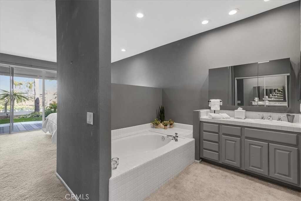 4 Logo Vista Dana Point, CA 92629 - Photo 23 of 44 a bathroom with a tub sink and mirror