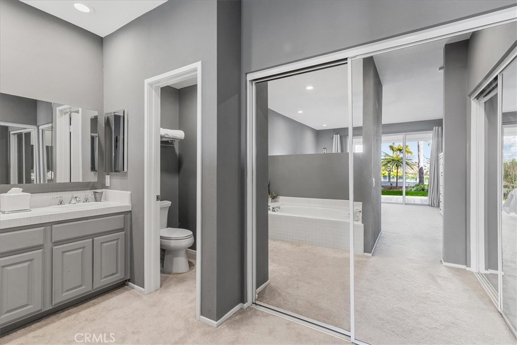 4 Logo Vista Dana Point, CA 92629 - Photo 24 of 44 a bathroom with a double vanity sink toilet and shower