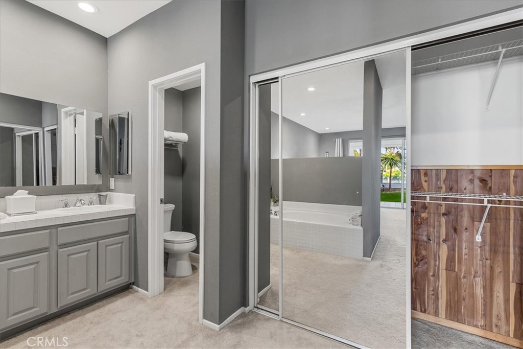 4 Logo Vista Dana Point, CA 92629 - Photo 25 of 44 a bathroom with a double vanity sink and a mirror