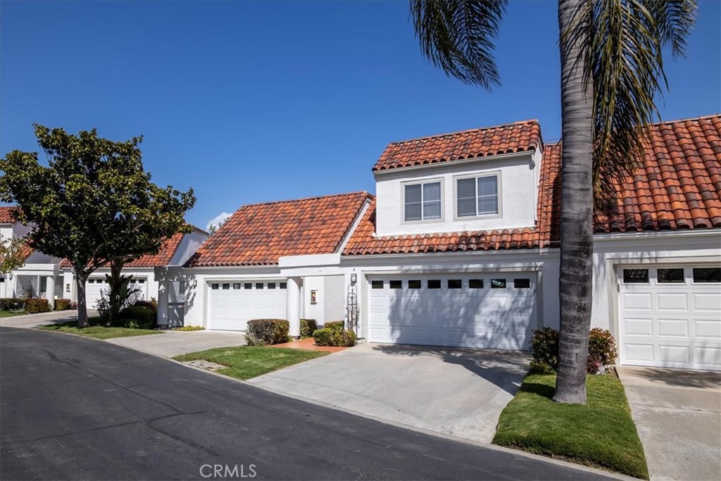 4 Logo Vista Dana Point, CA 92629 - Photo 3 of 44 a front view of a house with a garden and a garage