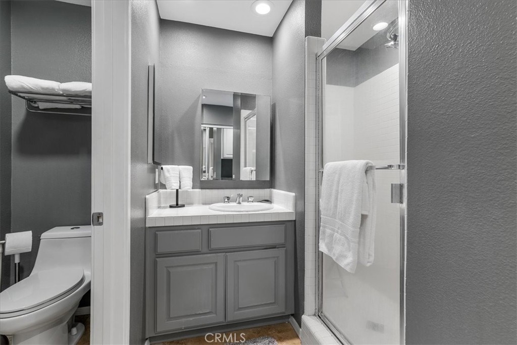 4 Logo Vista Dana Point, CA 92629 - Photo 31 of 44 a bathroom with a sink a toilet and shower