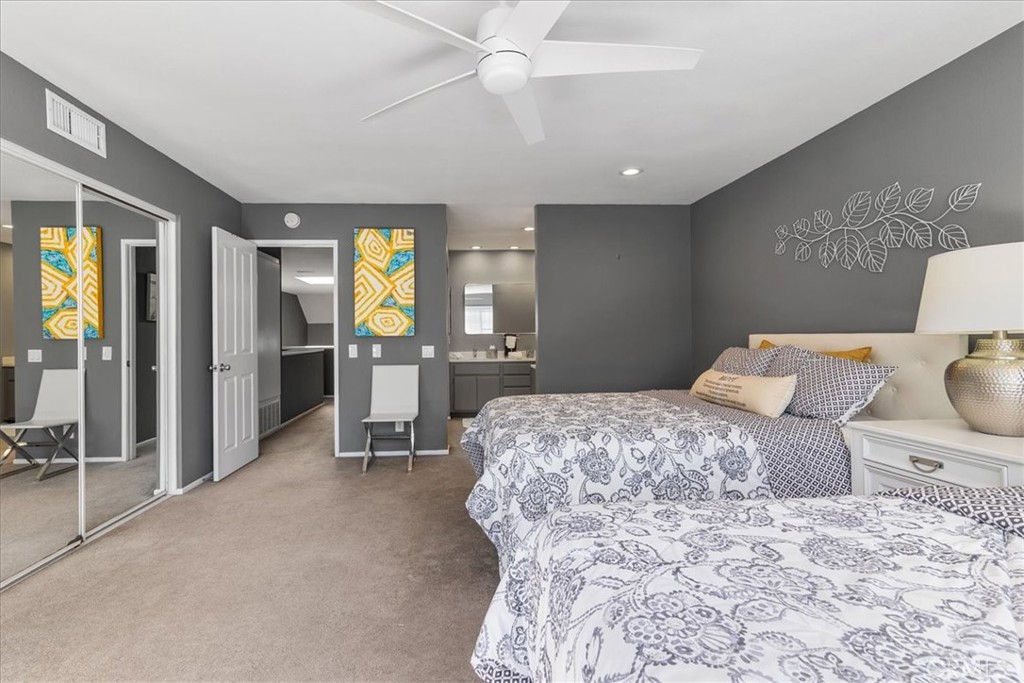 4 Logo Vista Dana Point, CA 92629 - Photo 34 of 44 a bedroom with a bed and large mirror with furniture