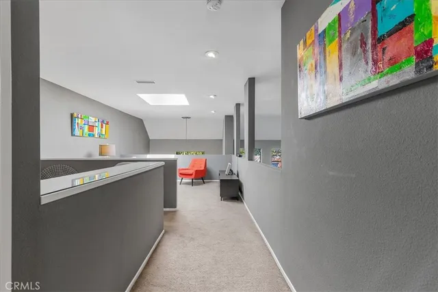 a view of a hallway with a kitchen