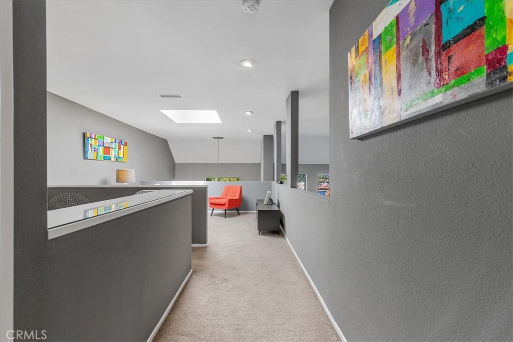 4 Logo Vista Dana Point, CA 92629 - Photo 37 of 44 a view of a hallway with a kitchen