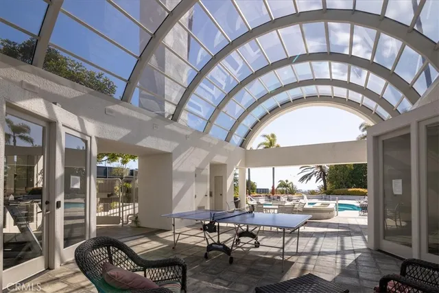 a living room with a outdoor seating space