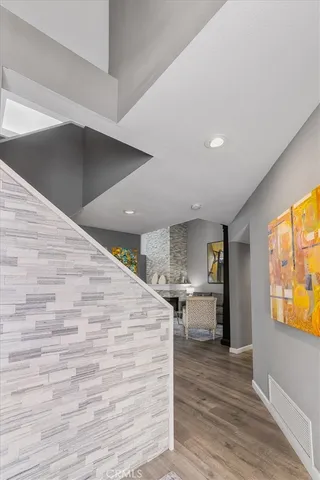 a view of kitchen living room with wooden floor and furniture